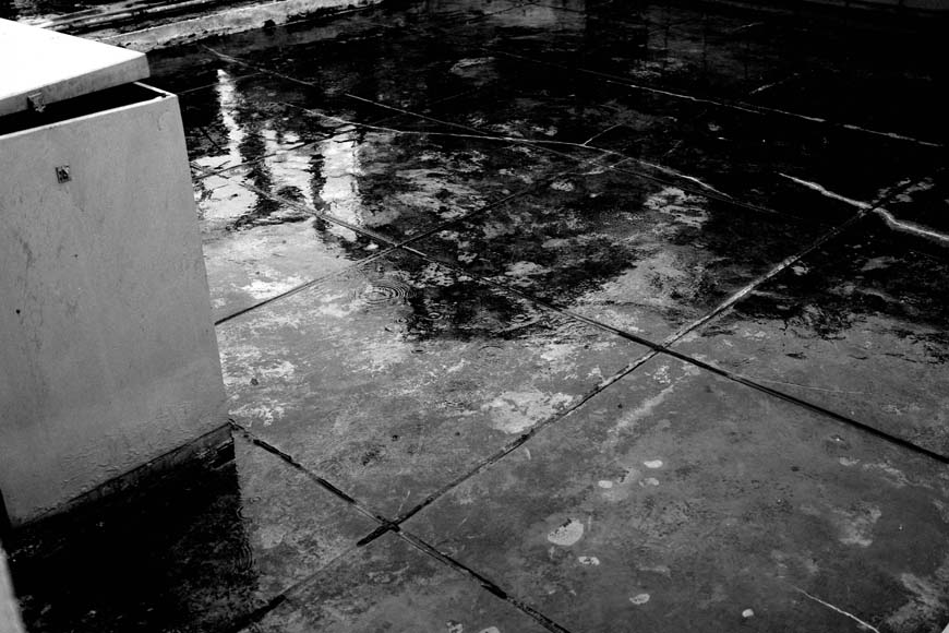 A black and white photo of a wet floor.
