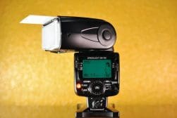 A camera with a flash attached to it.
