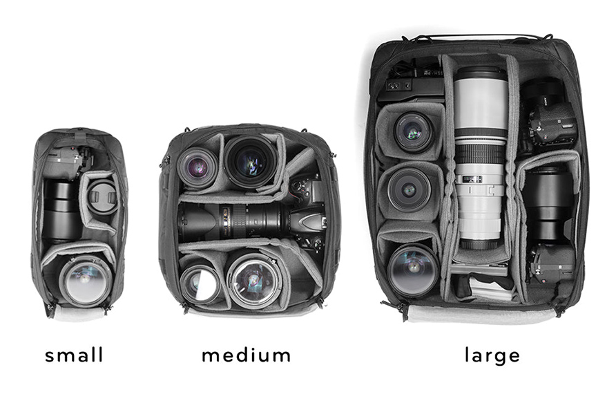 A camera bag with different sizes of cameras and lenses.
