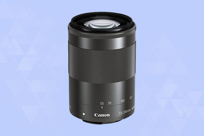 a Canon EF-M 55-200mm f/4.5-6.3 IS STM camera lens on a blue background.
