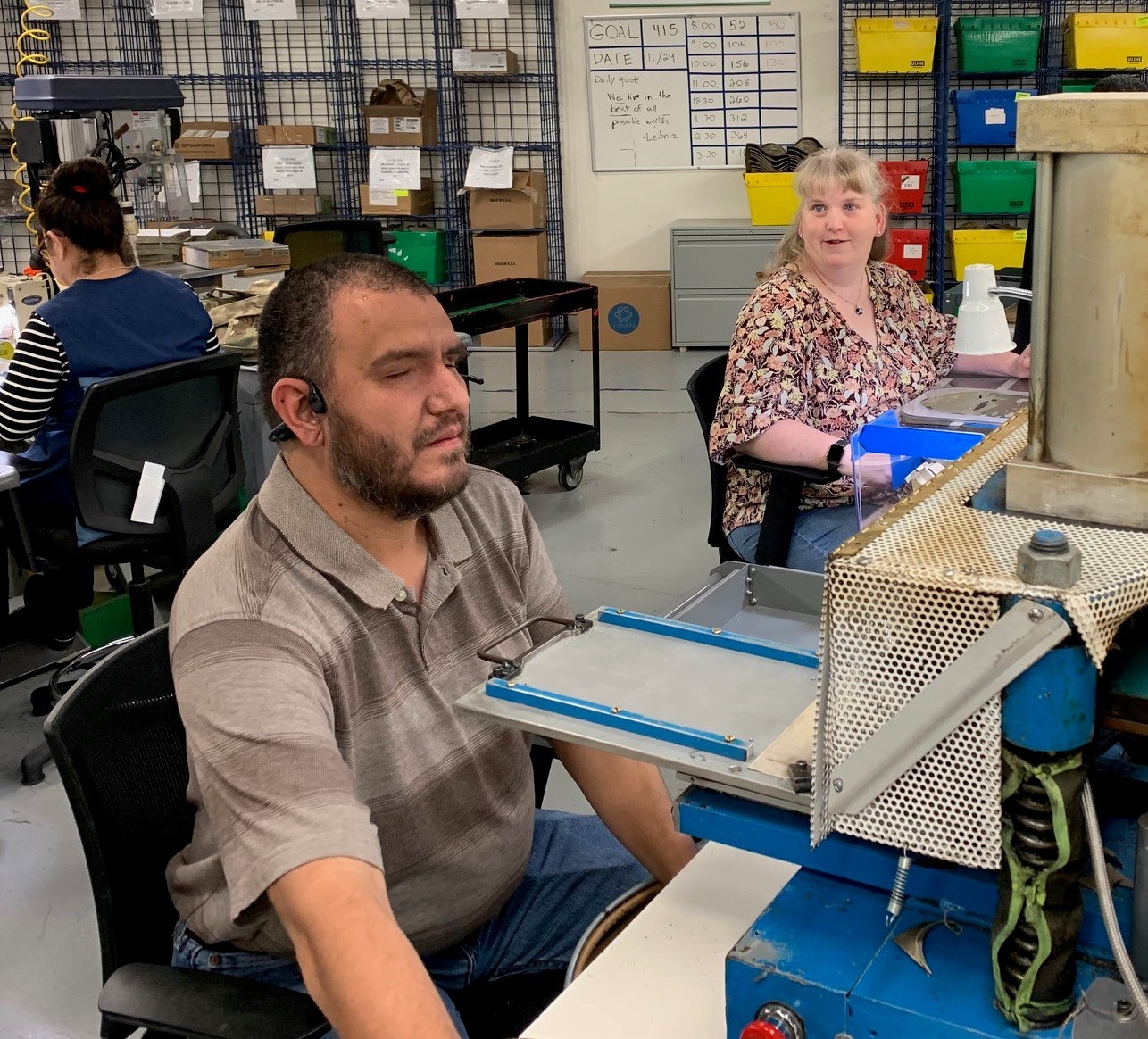 Ed and Keela Alonzo working by each other in the sewing department at Envision Dallas