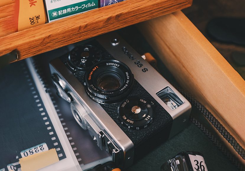 analog camera sitting in desk drawer