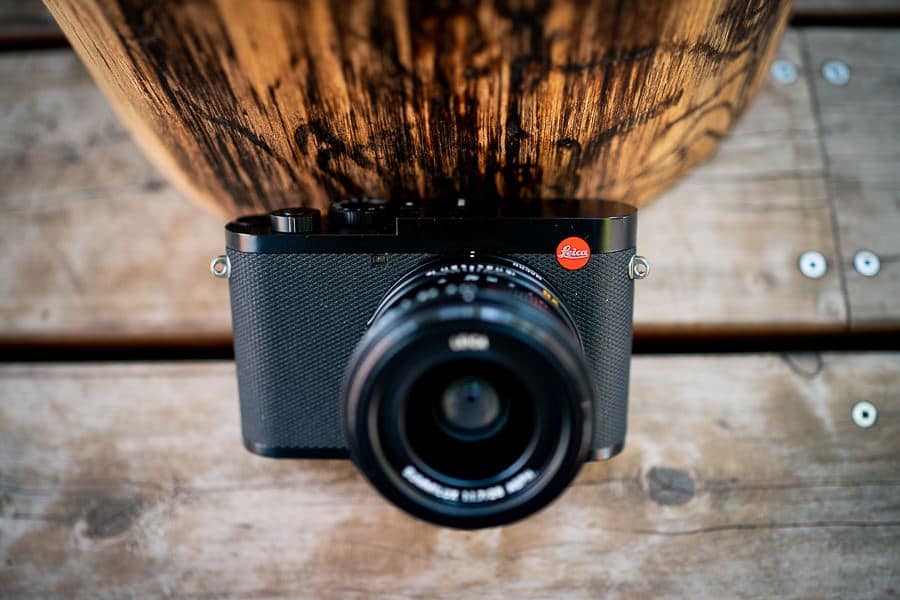 Leica Q2 on a wooden table.
