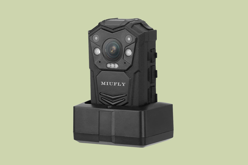a MIUFLY 1296P body camera on a green back ground