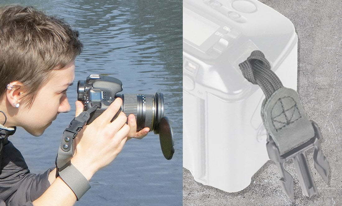 lady peers through camera over water with wrist strap attached 