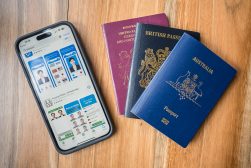 passports and iphone apps on table