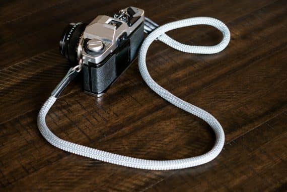 Rock and Roll rope strap attached to a 1970's Olympus OM-G film camera.