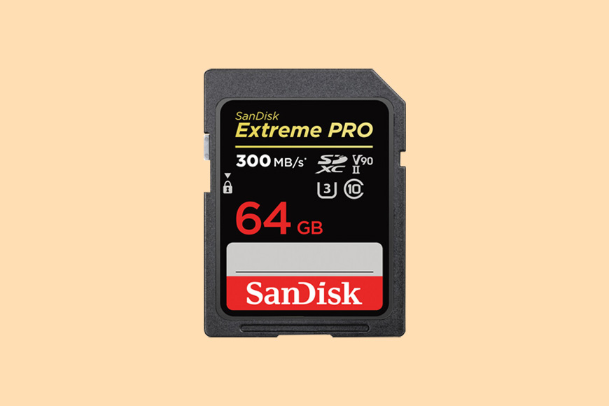 a sandisk extreme pro memory card on a yellow background.