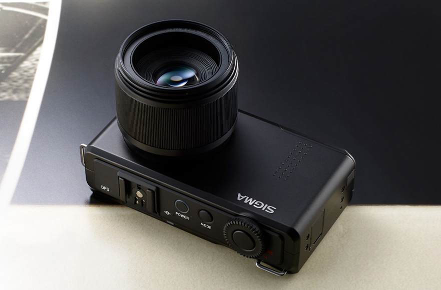 A camera with a lens on top of it.