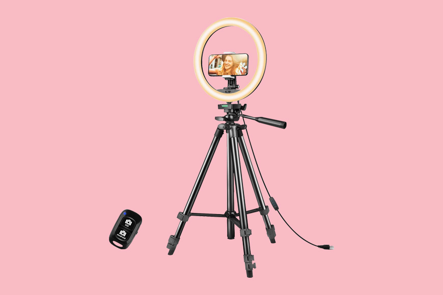 A tripod with a ring light and a remote.