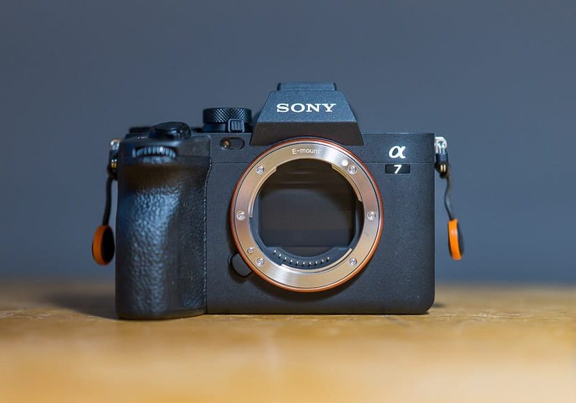 a sony camera sitting on top of a wooden table.