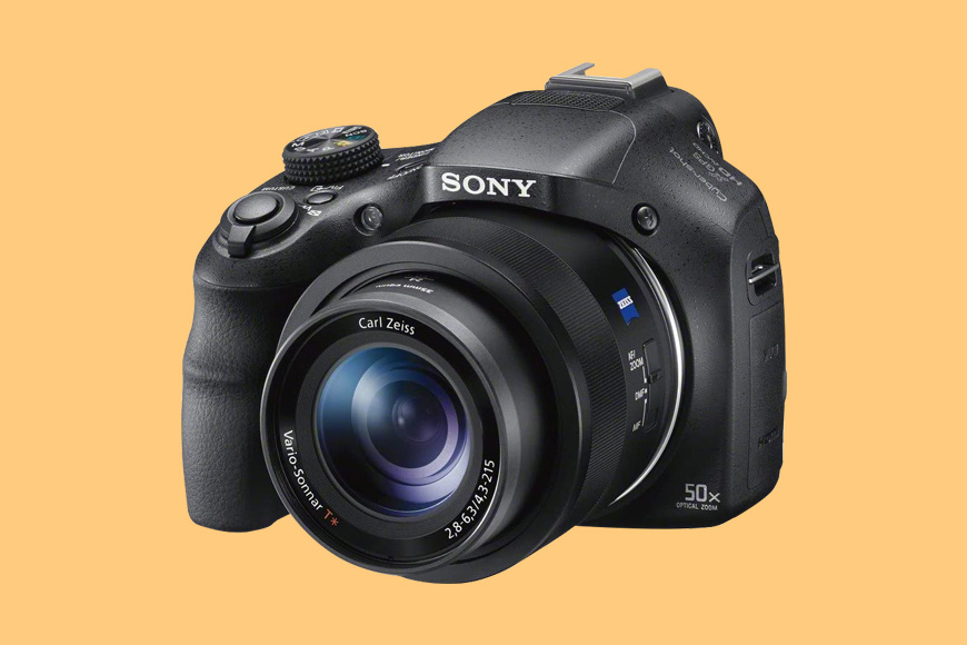 a Sony Cyber-Shot HX400V camera with a yellow background.