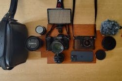 Camera gear sitting on a table.