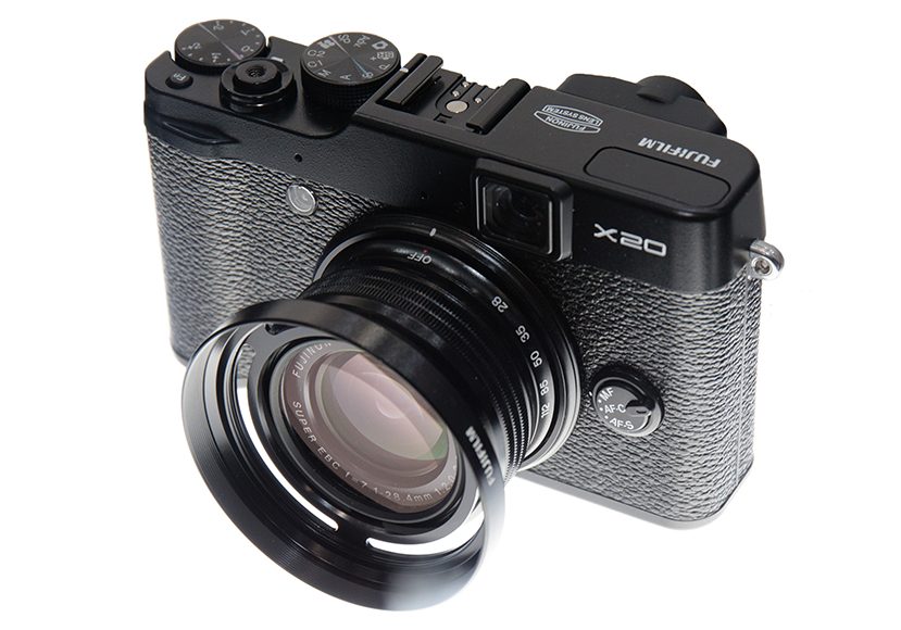 A black fuji x20 camera with a lens attached to it.