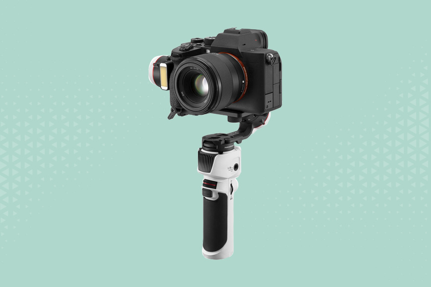 a camera attached to a Zhiyun Crane M3 GIMBAL on a green background.