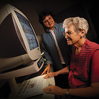 Woman, who is visually impaired, learns to use a CCTV at the new Envision Vision Rehabilitation Center.